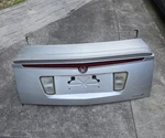 2005-2011 Cadillac Sts Oem Trunk Lid W/carpet Hinges/bolts & Spoiler/wing Used. Price: $400.00.
